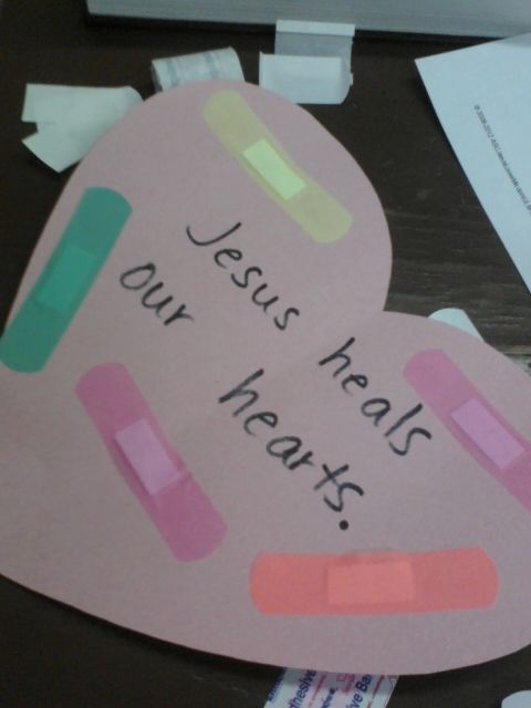 a paper cut out of a heart with the words jesus heals our hearts