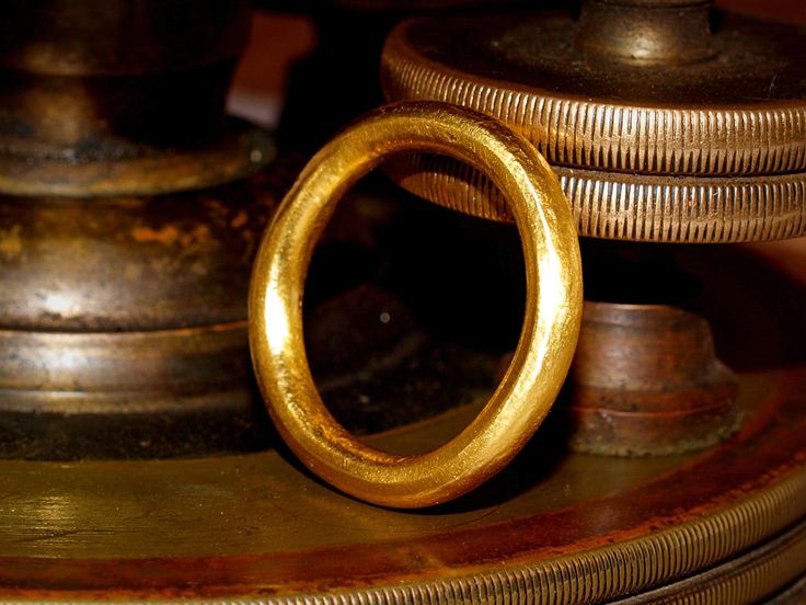 This is a solid gold ring constructed using pure 24k gold.  I start with refined .999 pure gold and melt it to red hot liquid metal, then forge it into a bar which is rolled and pulled into a smooth thick round wire, then formed into a band.  The brilliance of pure 24k (99.9% gold content) gold is unmistakable. The rich color stands out from most standard jewelry that is made from 14k (58.3% gold content) and 18k (75% gold content) jewelry. The band is a nice round shape with a thick 3mm diamete Ceremonial Gold Engraved Round Band Ring, Ceremonial Gold Engraved Ring With Round Band, Gold Engraved Ring For Ceremonial Occasions, Gold Hand Forged Round Band Rings, Ceremonial Gold Round Band Jewelry, Gold Round Band Jewelry For Ceremonial Occasion, Gold Hand Cast Rings For Anniversary, Gold Ring-shaped Bracelet For Anniversary, Hand Cast Gold Engraved Wedding Ring