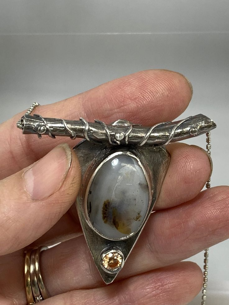 This pendant is nature-inspired. The Montana agate was pulled directly from the Yellowstone River in Montana. Nature-inspired Agate Jewelry For Gifts, One-of-a-kind Agate Pendant Jewelry, Amber Agate Pendant Jewelry, Nature-inspired Oval Pendant Jewelry For Healing, Nature-inspired Oval Agate Necklace, One Of A Kind Moss Agate Pendant, Artisan Agate Jewelry With Large Stone, Artisan Agate Jewelry With Large Pendant, Unique Moss Agate Jewelry With Natural Stones