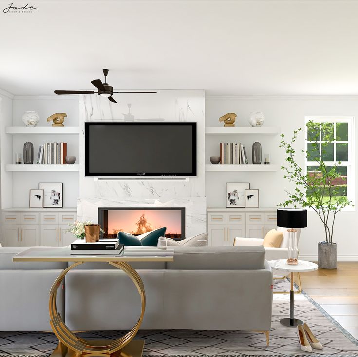 a living room with white furniture and a flat screen tv mounted above the fire place