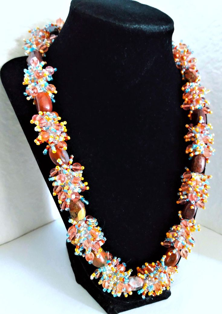 A handmade glass beaded necklace that is perfect for any occasion: parties, holidays, birthdays, anniversaries. All products are hand-crafted by my mother. Dimensions: - Actual Length: 24.3 cm - Collar Length: 22.0 cm - Width: 17.1 cm - Height: 2.0 cm Lightweight, high quality with a beaded hook as a clasp. Will respond to concerns and suggestions promptly. Acrylic Gems: 1.2 cm. Shipping costs: Free Domestic Shipping. All orders are sent by air-mail with tracking number. Time of delivery: Estimated 1-3 days for domestic shipping; international make take 7-14 days. Feel free to check out our other similar products! Link: https://noorsjewelers.etsy.com Artisan Necklace With Round Beads For Party, Unique Hand-strung Beads For Gifts, Artisan Beaded Necklace With Gemstone Beads As Gift, Handmade Crystal Necklaces With Round Beads For Jewelry Making, Artisan Crystal Necklace With Faceted Beads As Gift, Handmade Oval Beads Beaded Necklace For Gift, Handmade Oval Beads Beaded Necklace As Gift, Handmade Oval Beaded Necklaces For Gift, Artisan Round Beads Necklace For Parties