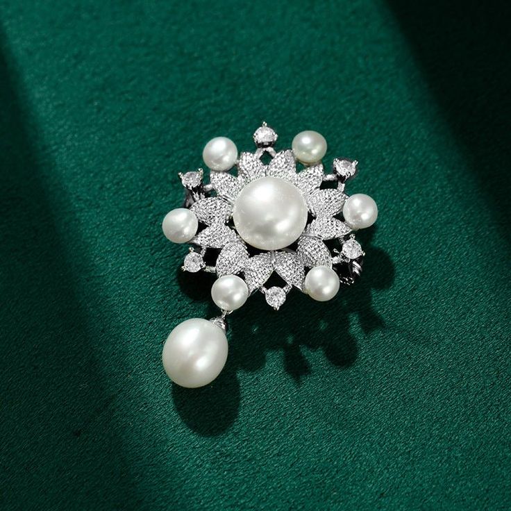 A glittering showstopper for any special occasion, this freshwater pearl snowflake brooch is a timeless gift for the special women in your life. Combining luxurious elegance and a unique design, it is the perfect choice for weddings, anniversaries, or Mother's Day. 👌 M A T E R I A L • 925 sterling silver• Natural Freshwater Pearls• This product is hypoallergenic (nickel free) and tarnish resistant 📏 S I Z E • Brooch Length: 4.5 cm ( 1.78 inch) • Brooch Width: 3.5 cm ( 1.38 inch) • Natural Fres Elegant Diamond White Brooches For Wedding, Elegant Diamond White Wedding Brooches, Elegant Snowflake Jewelry For Party, Elegant Diamond White Brooch For Gift, White Pearl Brooches For Formal Occasions, Elegant Diamond White Brooches As Gifts, Elegant Diamond White Brooches For Gift, Formal White Pearl Brooches, Elegant Snowflake Jewelry For Wedding