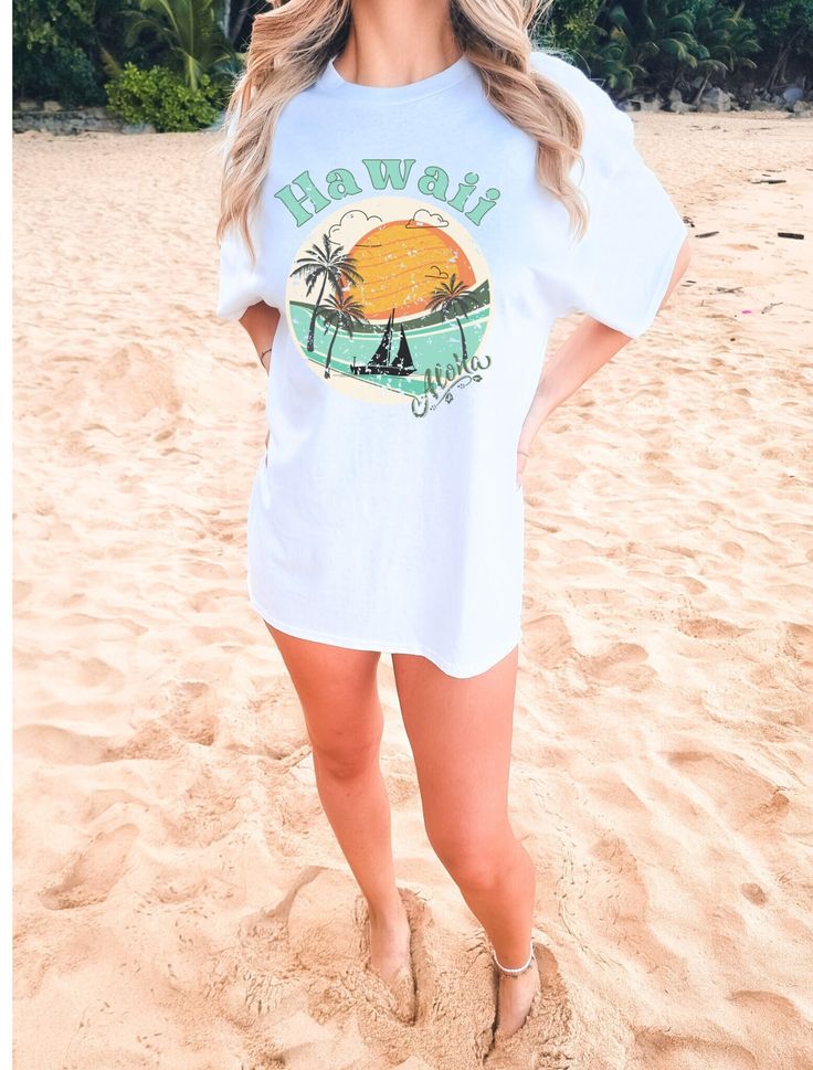 Get ready to be obsessed with your new Forever Hawaii Beach scene   Comfort Colors T-shirt the perfect way to emit those all-important Beachy vibes with a Retro feel * Q U I C K * F A C T S * .:Comfort Colors t-Shirt .: 100% ring-spun cotton .: Medium fabric (6.1 oz/yd² (206.8 g/m .: Relaxed fit .:Sewn-in twill label .:Care Instructions Machine wash: cold (max 30C or 90F); Do not bleach; Tumble dry: low heat; Iron, steam or dry: low heat; Do not dryclean. .:S I Z I N G * ✺ ✺ Sizing is unisex so runs like men's, though not overly large ✺ Most women find their typical size works best since they are meant to fit a touch loose ✺ Size guide and fit: please see the size chart in the images. Before ordering * S H I P P I N G * T I M E S * ✺ Our items are individually made with love for each of ou White Printed T-shirt For Day Out, Casual Crew Neck T-shirt For Vacation, White Tropical T-shirt For Beach Season, White Tropical Print T-shirt For Vacation, Casual Pre-shrunk T-shirt For Beach, Casual White T-shirt For Vacation, Beach Graphic Tee T-shirt With Print, Tropical Print T-shirt For Vacation, White Tropical Print T-shirt For Summer