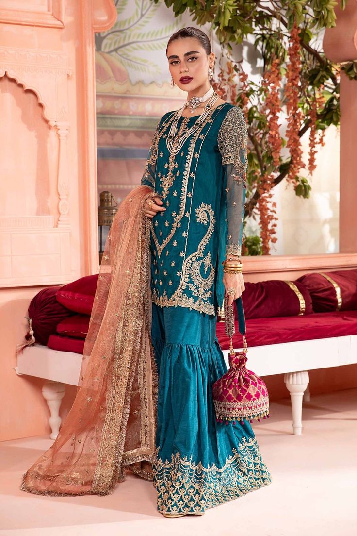 Royal Embroidered Pakistani Party Wear Gharara Kameez in Zinc Shade elevates your festive look in our embroidered gharara set, embellished with sequins, tilla & thread embroidery. Detailed Description: SKU: PB932 Detailing: Embroidery, Motifs, Naqshi, Sequins, Dabka, Beads, Tilla, Stones Color: Zinc Fabric: Silk, Net, Organza, Chiffon Design: Fully Embellished Dress with Embroidery and Floral designs Event: Bridal wear, Wedding Designer Sharara With Mirror Work For Eid, Festive Anarkali Sharara With Resham Embroidery, Festive Dola Silk Sharara With Intricate Embroidery, Eid Dola Silk Sharara With Dabka Work, Eid Sharara With Intricate Embroidery In Dola Silk, Eid Silk Sharara With Intricate Embroidery, Designer Eid Sharara With Mirror Work, Designer Mirror Work Sharara For Eid, Festive Chinon Sharara With Intricate Embroidery