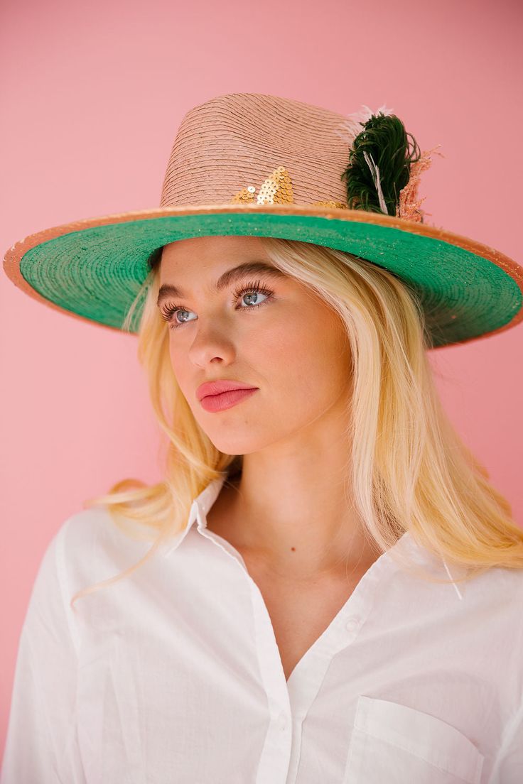 Get ready to be the coolest cat on the island with THE ISLAND CAT SUN HAT! This light pink hat features gold accents and a sequin gold palm tree patch, along with a playful mix of pink and black feathers and a stylish leopard patch. Keep the sun at bay while making a statement. Meow! This hat is ONE OF A KIND, created by our owner Stephanie. To receive item quicker, expedited shipping is available at checkout. Feathered Hat Bands For Beach Events In Summer, Feathered Brimmed Hat Bands For Summer, Brimmed Hat Bands With Feathers For Summer, Beach Hats With Feathers For Spring, Summer Costume Hats With Feathers And Wide Brim, Summer Feathered Wide Brim Costume Hats, Summer Brimmed Hat With Feathers, Summer Wide Brim Feathered Costume Hats, Summer Wide Brim Hat With Feathers