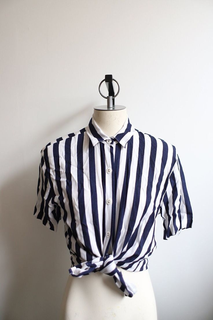 "Vintage 1980s 90s white and dark blue striped blouse. Padded shoulders.  B R A N D ++ Jacyln Smith S I Z E ++ marked a size 12 M A T E R I A L S ++ 100% Rayon C O N D I T I O N ++ good vintage condition, light wear. No holes or stains.  M E A S U R E M E N T S ++ s l e e v e   l e n g t h - 8\"  s l e e v e  w i d t h - 8\" s h o u l d e r - 18\" b u s t - 36\" w a i s t - 38\"  l e n g t h - 25\"  Please message me before you purchase if you have any questions, need additional measurements, photos or expedited shipping.  Thank you so much for looking! :)" Summer Blue Blouse With Striped Collar, White Button-up Top With Vertical Stripes, Casual Pinstripe Collared Blouse, White Vertical Stripe Button-up Top, Classic Pinstripe Blouse For Summer, Vertical Stripes Shirt For Summer Workwear, Striped Shirt For Summer Workwear, White Summer Blouse With Vertical Stripes, White Blouse With Vertical Stripes For Summer