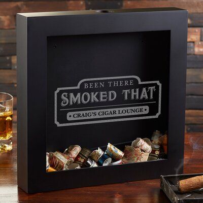 Choose the been there smoked that personalized cigar label shadow box to creatively display and store used cigar bands. Great for birthdays, father's day, retirement gifts, and other special occasions. The cigar lovers in your life will love showing off their smoking accomplishments! Customize: Yes | Personalization Mall Cigar Label Shadow Box Wood in Black / Brown, Size 12.0 H x 12.0 W x 2.0 D in | Wayfair | Home Decor Groomsmen Ideas, Bday Gifts For Him, Surprise Gifts For Him, Personalization Mall, Thoughtful Gifts For Him, Romantic Gifts For Him, Groomsmen Gifts Personalized, Diy Gifts For Him, Cigars And Whiskey