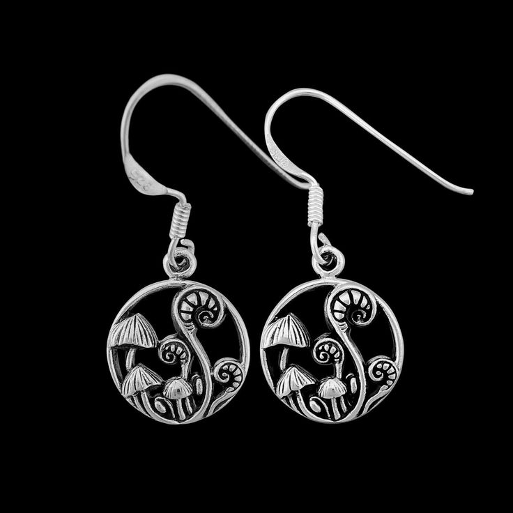 "Immerse yourself in the whimsical allure of nature with our enchanting 925 sterling silver mushroom and fiddlehead fern dangle earrings. These earrings feature intricate designs inspired by mushrooms and fiddlehead ferns, creating a captivating and unique accessory. Crafted with meticulous attention to detail, these earrings showcase the intricate beauty of these natural elements, making them a perfect nature-inspired gift.Measuring approximately 0.47\" in diameter (excluding the ear wire), the Whimsical Sterling Silver Hypoallergenic Jewelry, Whimsical Sterling Silver Jewelry With Matching Earrings, Whimsical Mushroom Drop Earrings, Whimsical Sterling Silver Dangle Earrings, Whimsical Silver Jewelry With Mushroom Design, Whimsical Sterling Silver Drop Earrings, Mushroom Design Drop Earrings, Nature-inspired Dangle Earrings With Mushroom Design, Nature-inspired Dangle Jewelry With Mushroom Design