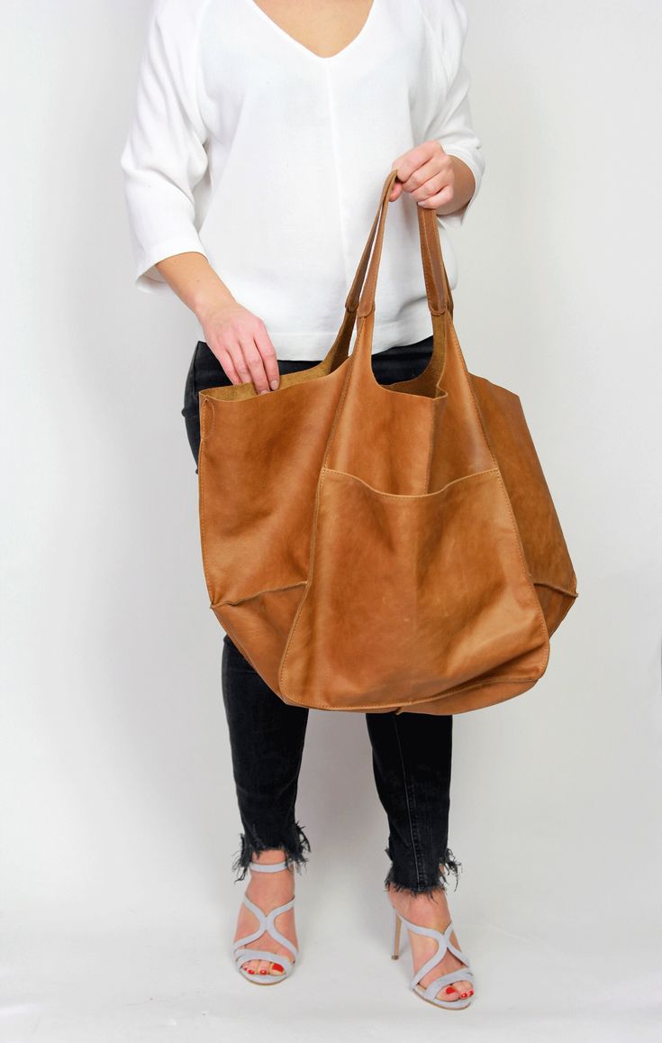 CAMEL BROWN Soft Tote Bag, Large Leather Weekender Bag, Soft Diaper Bag, Leather Purse, Slouchy Leather Bag, Soft Tote Bag,  BOLOGNA Bag My structure: I'm very soft (you can easily fold me and fit into a suitcase when travelling) with an external open front pocket, a top magnet fastening, an inside zip pocket and a slip pocket right behind it.  My base panel is also soft, not reinforced. If you're in search of a tote with a more rigid structure, take a look at my cousins - ROME bag https://etsy. Diaper Bag Essentials, Brown Leather Tote Bag, Slouchy Tote, Large Leather Bag, Leather Weekender Bag, Leather Weekender, Large Leather Tote Bag, Soft Leather Bag, Stylish Tote Bag