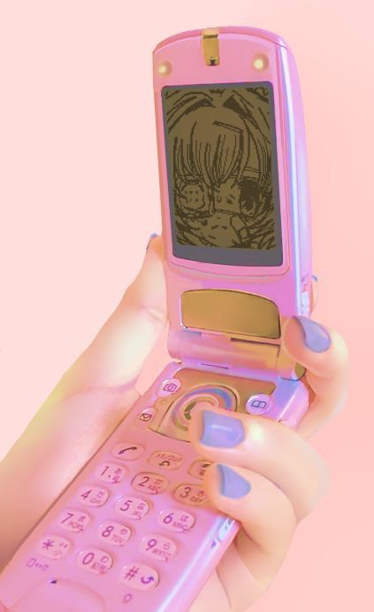 a person holding a pink cell phone in their hand with a drawing on the screen