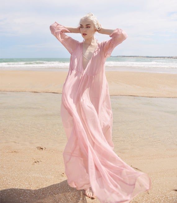 Pink V-neck Boho Dress For Beach Cover-up, Feminine Summer Chiffon Beach Dress, Feminine V-neck Boho Dress For Beach, Feminine Chiffon Beach Dress For Summer, Breezy Pink V-neck Maxi Dress, Summer Beach V-neck Chiffon Dress, Pink Bohemian Chiffon Dress For Summer, Bohemian Pink Chiffon Dress For Summer, Long Sleeve Chiffon Dress For Summer Beach