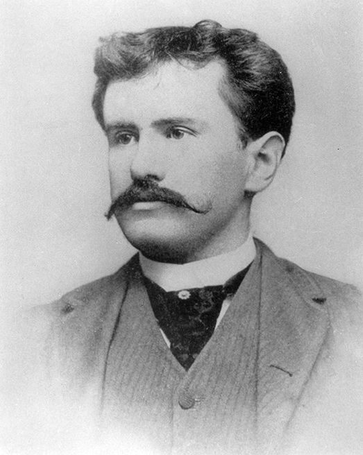 an old black and white photo of a man with a mustache