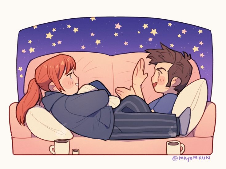 a man and woman laying on a couch with their arms around each other, looking at the stars in the sky