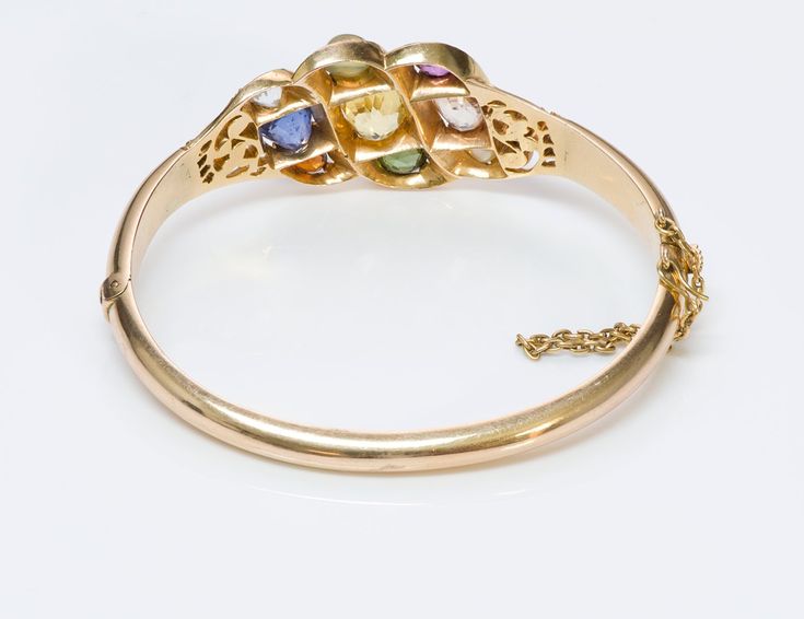 Navaratna Gemstone Bracelet.Antique Navaratna multi-color gemstone yellow gold bangle bracelet. Wearing the nine gems is said to provide an astrological balance and benefit to the wearer. According to Hindu astrology life on earth is influenced by the navagrahas, or nine influencers. "nine celestial bodies of universe ". Yellow Gold Oval Bangle With Gemstone, Fine Jewelry Yellow Gold Multi-stone Bangle, Antique Multi-stone Bracelets As Gift, Antique Multi-stone Bracelet As Gift, Yellow Gold Multi-stone Bangle In Fine Jewelry Style, Yellow Gold Multi-stone Oval Bracelets, Yellow Gold Oval Bracelet With Multi-stone, Yellow Gold Multi-stone Oval Bracelet, Heirloom Yellow Gold Multi-stone Bracelets