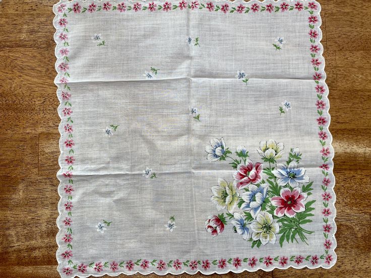 "An beautiful vintage floral handkerchief. It has a white, sheer base with white, blue and green flowers all over, and yellow, green, blue, and pink flowers in the corner. It also has white, scalloped trimming on the edges. Perfect for using as a quilt square for a quilt. It measures 14 1/2\" by 14 1/2\". It is in great vintage condition with no rips, tears or holes. Unused. Please come visit our shop to view our entire vintage selection at GoosesTreasureShop- https://www.etsy.com/shop/GoosesTre Blue And Green Flowers, Floral Handkerchief, Quilt Square, Yellow And Pink, Square Quilt, Green Flowers, White Green, Vintage Pink, Vintage Floral