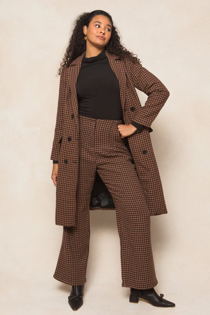 Get ready to strut your stuff in our Tabitha Trousers! Made from a chic houndstooth woven fabric in brown, black, and rust, these ankle length slacks are the perfect addition to any fall wardrobe. With convenient pockets, a secure hook and bar closure, and full lining, these non-stretch slacks offer both style and functionality. Time to step up your fashion game! Winter Herringbone Pattern Pants For Work, Brown Bottoms For Business Casual In Fall, Brown Bottoms For Fall Workwear, Plaid Pants For Business Casual In Fall, Fall Business Casual Houndstooth Bottoms, Winter Office Brown Bottoms, Fall Houndstooth Pants For Workwear, Winter Houndstooth Bottoms For Workwear, Houndstooth Pattern Bottoms For Winter Workwear