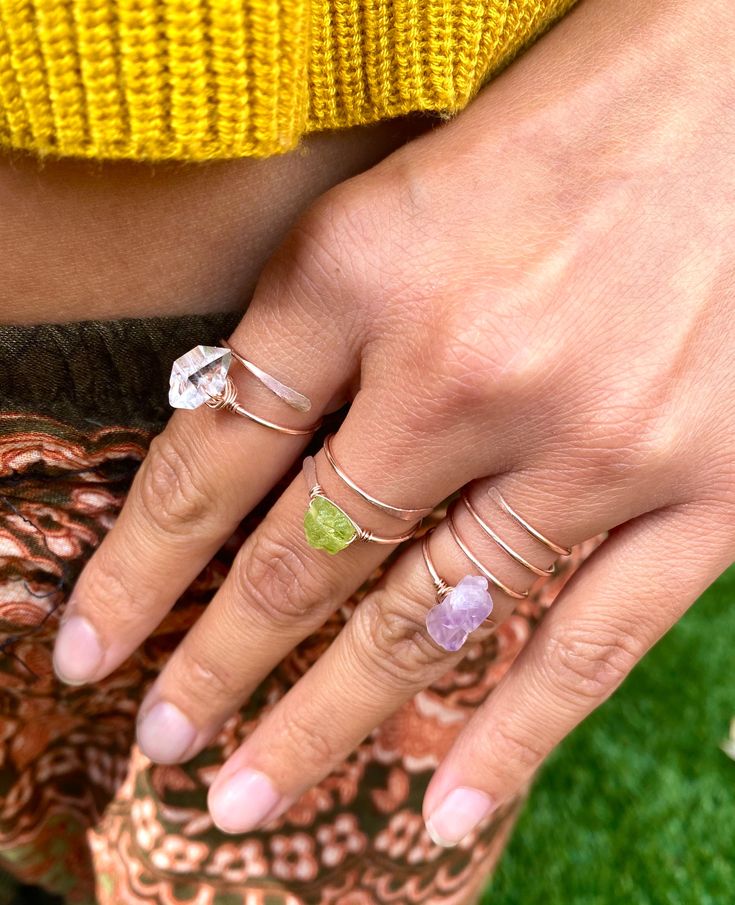 💚Raw and natural tiny peridot stone in adjustable dainty 18g gold or silver ring band with hand hammered ends. Perfect dainty little ring that can fit any fingers of your choice. 💚Peridot - An August birthstone. This gift from the heart of Mother Nature comes with a ton of healing properties. Deep-set calm, good health, restful slumbering, and restoring balance and harmony to the body, mind and soul are just a handful of things you can expect when you say yes to Peridot. Ring size- Fits 5-8 ad Raw Peridot, Dainty Gold Ring, August Birthstone Ring, Green Gemstone Ring, Raw Stone Ring, Bohemian Ring, Dainty Gold Rings, Tiny Rings, Peridot Stone