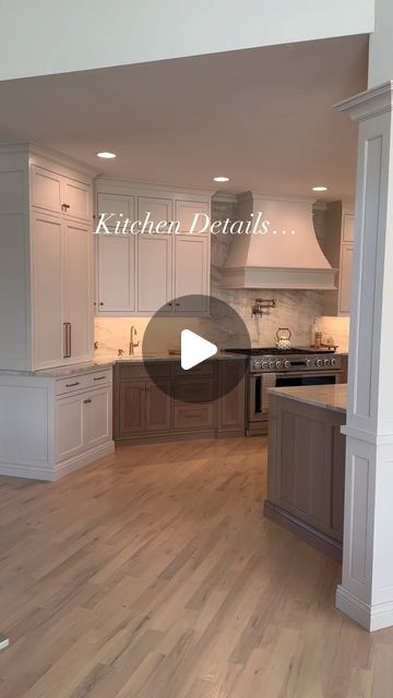 an open kitchen with white cabinets and wood flooring in the center is featured on this video