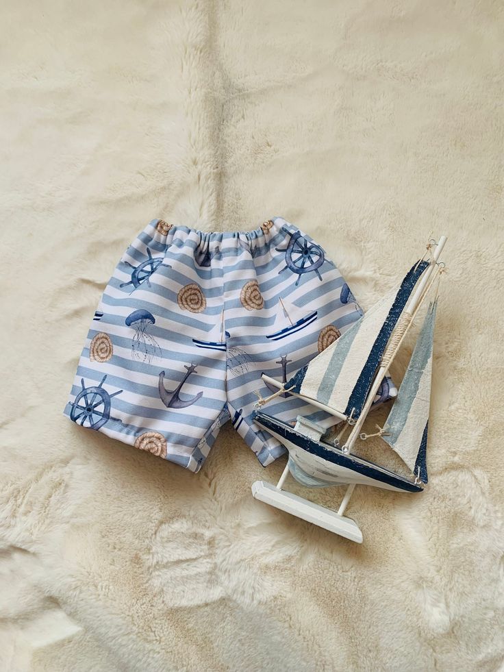 Unisex baby/ toddler shorts This design is made in a lovely 100% cotton nautical fabric  The waist is elasticated for comfort and the shorts are fully lined These little shorts are perfect for warmer days on the beach/holiday Summer Style Short Swim Trunks For Play, Summer Short Swim Trunks For Playwear, Cotton Bermuda Swim Trunks For Summer, Cotton Bermuda Shorts For Beach Vacation, Playful Summer Shorts With Elastic Waistband, Bermuda Cotton Swim Trunks For Vacation, Cotton Bermuda Shorts With Elastic Waistband For Beach, Summer Cotton Casual Bottoms, Blue Beachwear Bottoms For Playwear