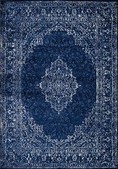 a blue rug with an intricate design on the middle and bottom, it is shown