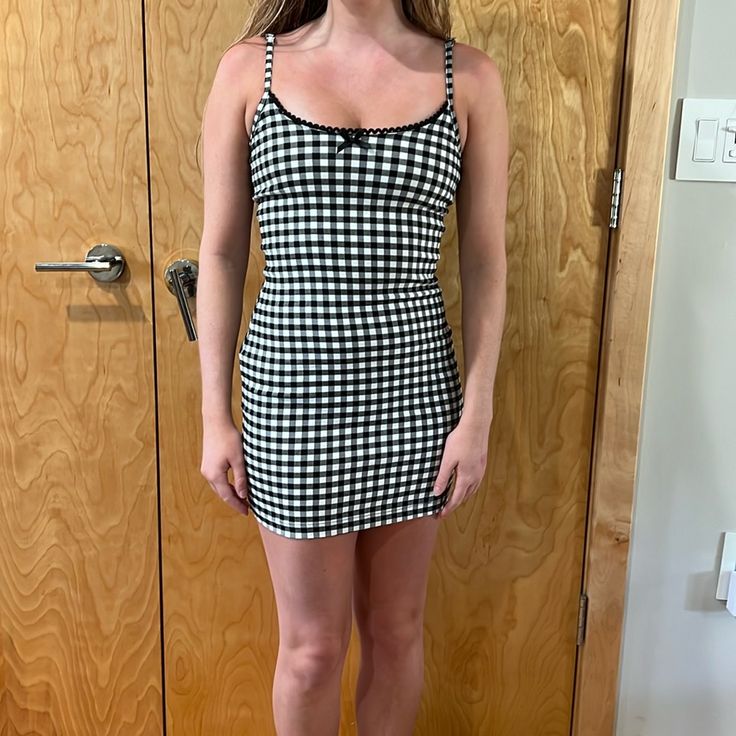 Black And White Plaid Black Plaid Mini Dress For Picnic, Black Mini Plaid Dress For Picnic, Spring Black Plaid Mini Dress, Spring Black Plaid Mini Length Dress, Casual Gingham Mini Dress, Black Plaid Mini Dress For Spring, Black Plaid Mini Dress For Summer, Trendy Fitted Plaid Mini Dress, Trendy Mini Length Plaid Dress