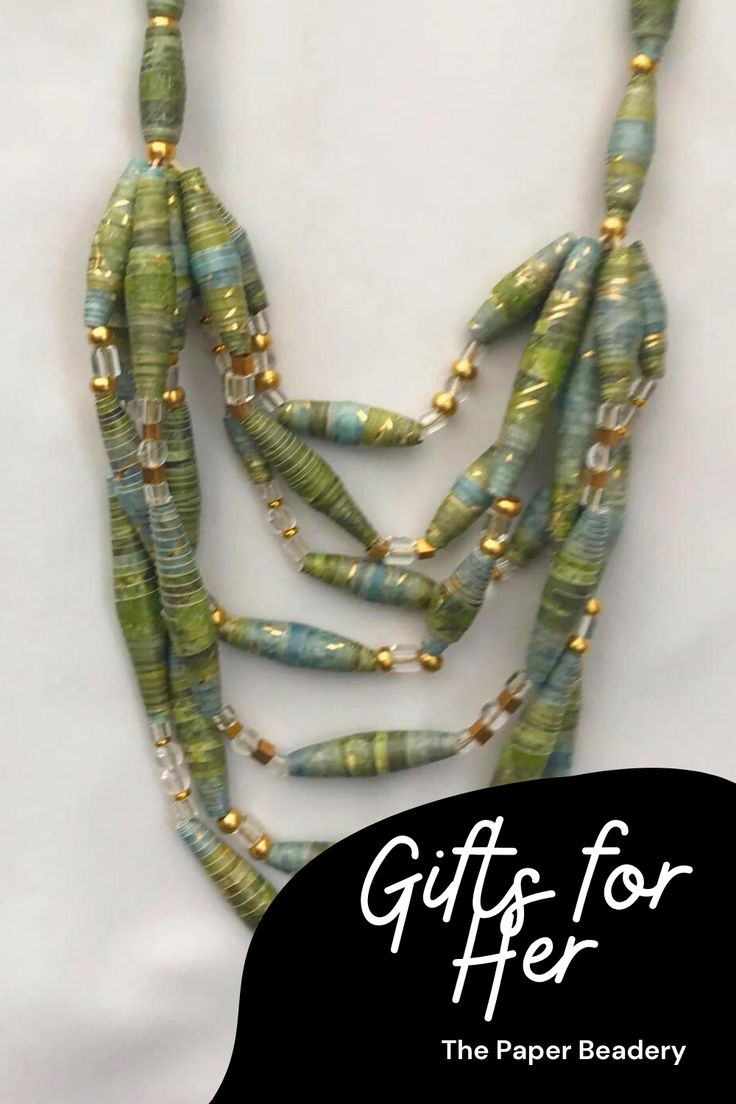 Give her the perfect gift that's as distinct as she is with handmade paper bead jewelry. Each piece is one of a kind and can easily be worn with all her favorite outfits. Buy her a chunky multi-strand necklace, a colorful stack of bracelets, or simple drop earrings. Paper bead jewelry is lightweight and comfortable to wear. And best of all-it's affordable. Buy a piece for every woman in your life. FREE SHIPPING #goldbeadnecklace #trendybeadjewelry #jewelryasagift #bestgiftsforwoman #necklaces Multi-strand Green Jewelry For Gift, Green Multi-strand Jewelry For Gift, Green Multi-strand Jewelry Gift, Green Multi-strand Beads For Gifts, Green Beaded Necklace With Gold Beads As Gift, Green Necklaces With Gold Beads For Jewelry Making, Green Multi-strand Beaded Necklace For Gift, Green Multi-strand Beaded Necklace As Gift, Green Necklaces With Gold Beads For Gift