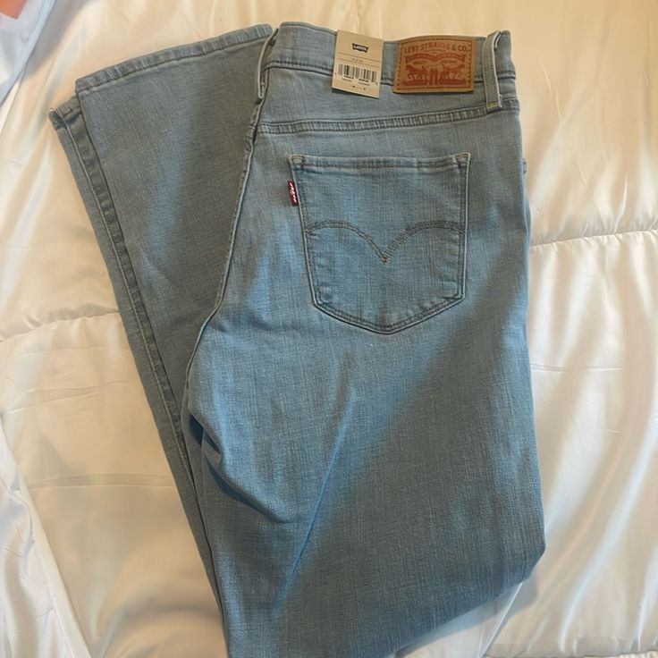 Brand New- Mid Rise, Tummy Slimming, Shapes Through The Hip And Thigh Size : 31 X 30 Levi's Straight Leg Denim Blue Bottoms, Fitted Cropped Leg Light Wash Pants, Fitted Light Wash Cropped Pants, Fitted Cropped Light Wash Pants, Light Blue Straight Leg Pants With Five Pockets, Levi's Wide Leg Blue Pants, Levi's Blue Wide Leg Jeans, Levi's Denim Blue Pants With Pockets, Levi's Blue Wide-leg Jeans