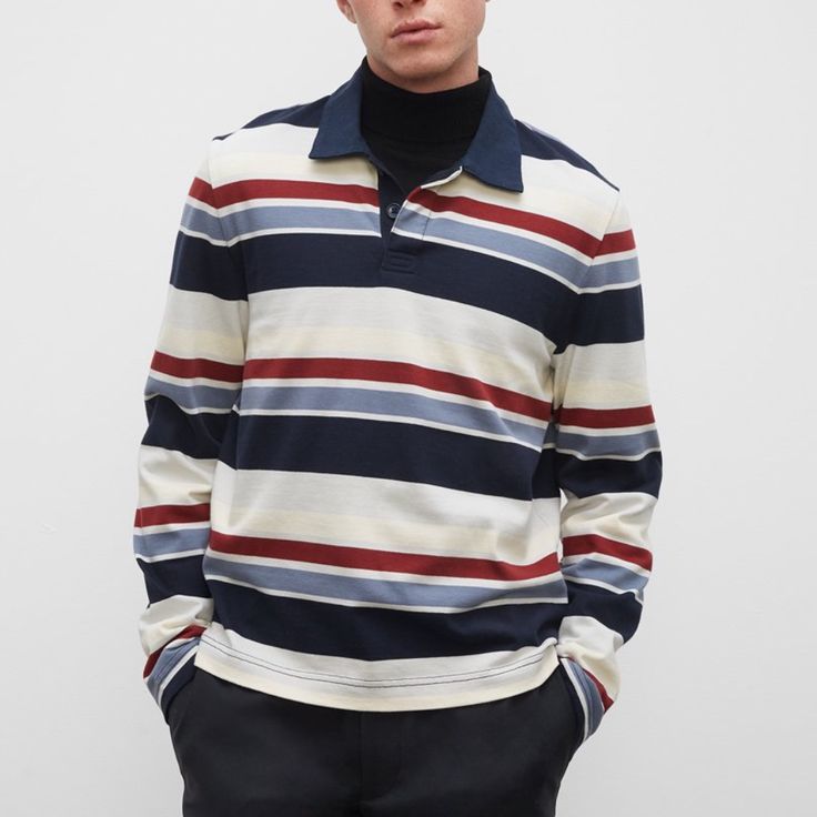 This One's A Score. Our Long-Sleeve Rugby Shirt Is Built Better With A Medium-Weight Cotton For Breathable Comfort, A Clean Twill Collar, And A Vibrant Stripe Pattern. Designed For An Easy, Comfortable Fit. The Real Mvp. In A Bold Stripe Pattern 100% Cotton Relaxed Fit With A 27" Length; Based On A Size M Concealed Two-Button Half Placket Twill Spread Collar; Long Sleeves; Straight Hem Machine Wash Imported Sku 223 Navy Polo Top With Striped Collar, Blue Long Sleeve Shirt With Striped Collar, Navy Fitted Top With Striped Collar, Fitted Navy Top With Striped Collar, Relaxed Fit Multicolor Tops For Work, Navy Relaxed Fit Collared Top, Navy Collared Top With Relaxed Fit, Navy Long Sleeve Top With Striped Collar, Casual Striped Collared Tops