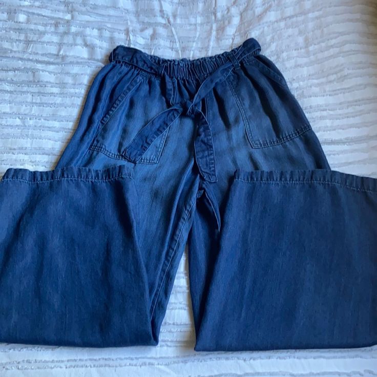 Nwot Universal Thread Wide Leg Denim Blue Pants. Elasticize Waist With Adjustable Toe Belt. Dark Blue Color. Waist Is About 13 Inches Across But Stretches A Few More Inches. Inseam Is 25 Inches. Pockets In The Front. Worn Once No Flaws. Size Xs But Can Fit Up To A Medium Medium Wash Wide Leg Bottoms With Elastic Waistband, High Rise Dark Wash Bottoms With Elastic Waistband, Dark Wash Wide Leg Pants With Elastic Waistband, Casual Indigo Bottoms With Elastic Waistband, Indigo Casual Bottoms With Elastic Waistband, High Rise Blue Bottoms With Elastic Waistband, Blue High Rise Bottoms With Elastic Waistband, Blue Denim Wide Leg Pants With Elastic Waistband, Blue Wide Leg Jeans With Elastic Waistband