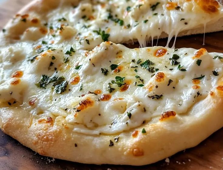 a close up of a pizza on a cutting board