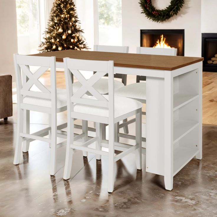 a table with chairs and a christmas tree in the background