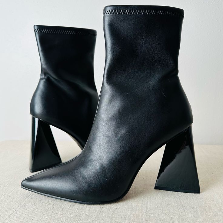 Brand New, No Box, Price Is Firm. Make A Statement In Any Outfit With The Ticker Bootie From Steve Madden. This Ankle Boot Features A Unique Triangular Block Heel That Complements The Pointed Toe For Added Drama. Inside Zipper Closure Pointed Toe Textile & Synthetic Lining Padded Footbed Approx. 6" Shaft Height Approx. 10" Leg Opening 4" Triangle Block Heel Tags: A-Line Animal Abstract Bright Babydoll Boho Bootcut Bustier Beaded Braided Boyfriend Boxy Bell Sleeve Backless Baggy Belted Bustier Bo Medium Width Synthetic Heeled Boots With Pointed Toe, Black Heeled Boots With Sculpted Heel For Party, Party Black Boots With Contrasting Heel Counter, Synthetic High Heel Boots With Sculpted Heel, Black Heels With Reinforced Heel For Winter, Black High Heel Boots With Contrasting Heel Counter, Black High Heel Boots With Contrasting Heel, Black Boots With Sculpted Heel And Medium Width, Black Heeled Boots With Sculpted Heel For Work