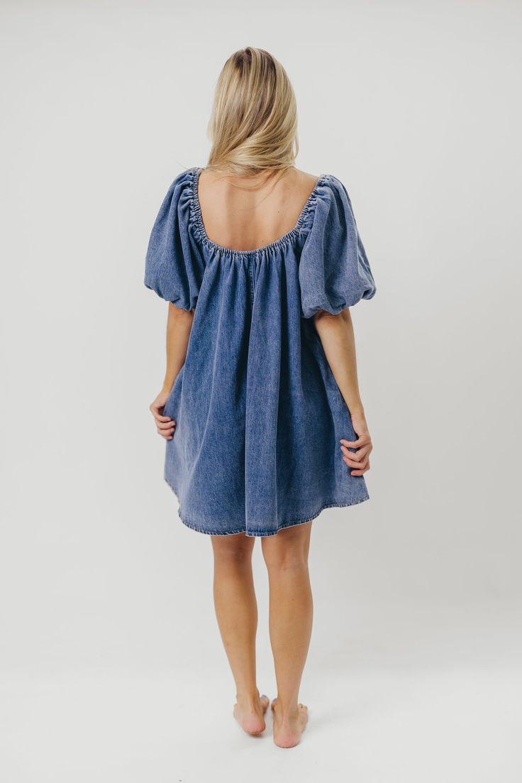 The Morgan Mini Dress is a summer essential -- she's quirky, on-trend, and (thanks to her 100% cotton construction), incredibly comfortable. We love how easy it is to dress this mini up with wedges and accessories, or dress it down with tennies or slides for a day of shopping or sightseeing. You don't want to miss out on this unique addition to your closet! FIT: Runs true to size - relaxed fit. MATERIAL: 100% Cotton. GARMENT DETAILS: Cotton denim mini dress with a swing silhouette and square, el Babydoll Mini Dress, Garment Details, The Morgan, Summer Essential, Denim Mini Dress, Denim Mini, Babydoll Dress, Summer Essentials, To Miss