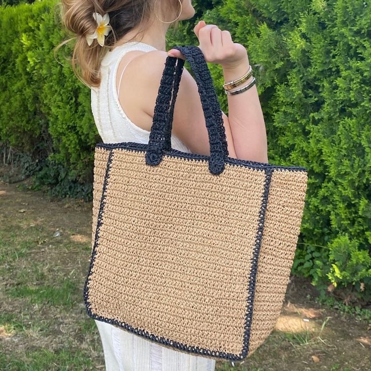 Embrace the summer vibes with our Handmade Straw Beach Bag, featuring elegant black striped.  Crafted with care, it is designed to be carried comfortably on the shoulder or by hand. Material: Eco-Friendly High-Quality paper yarn.  👙🏖️Perfect for beach outings, shopping trips, or daily use. Upgrade your summer style with this versatile and chic beach bag.  You can easily fit your personal items such as a towel, sunscreen, bikini, book, and magazine.  Get yours today and enjoy the perfect blend Eco-friendly Black Crochet Bag For Travel, Black Crochet Bag For Everyday Spring Use, Black Crochet Bag With Braided Handles For Summer, Large Capacity Black Crochet Bag For Vacation, Black Straw Bag For Spring Vacation, Spring Black Crochet Bag For Everyday Use, Black Crochet Bag For Beach Season Travel, Black Rectangular Crochet Bag For Beach Season, Spring Black Beach Bag With Braided Handles