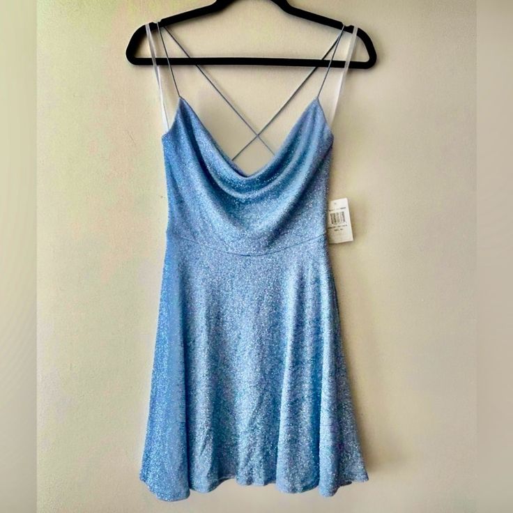 Questions? Leave A Comment Below! Brand New Blue B. Darlin Mini Cocktail Dress. Size 1/2. This Dress Has A Swoop Neckline With The Spaghetti Straps And Cross Back! The Fabric Has A Little Bit Of Stretch. It Can Be Worn For Homecoming, And Night Out. New With Tags.Retail $89., It’s Sparkly+ Has A Pattern On It!! Blue V-neck Holiday Mini Dress, Blue Shimmer Dress For Night Out, Blue Glitter Dress For Date Night, Blue Glitter Dress For Homecoming, Blue Shimmer Mini Dress For Evening, Shimmer Dress For Homecoming In Spring, Glamorous Blue Glitter Mini Dress, Fitted Blue Shimmer Dress, Blue Sleeveless Shimmer Dress