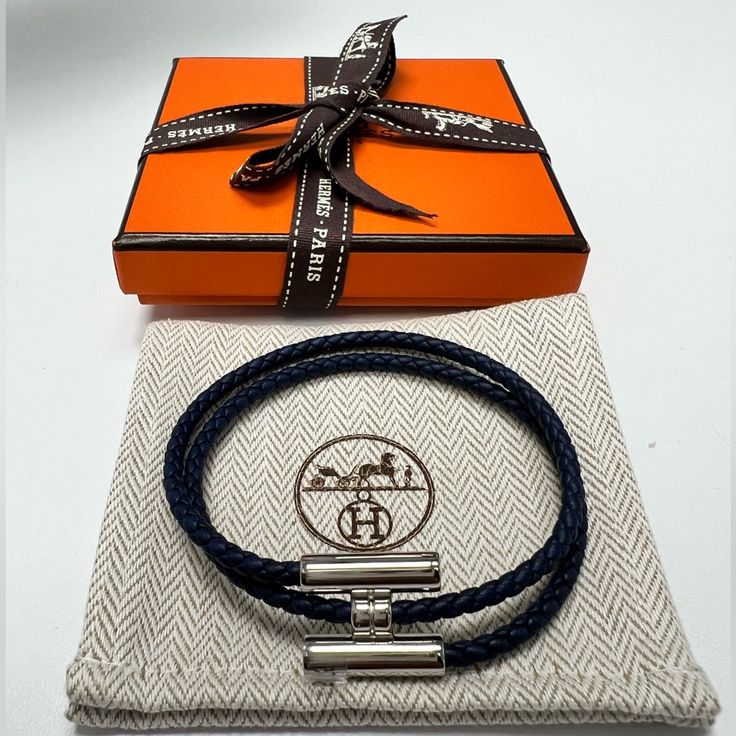 Hard To Find Colorbrand New Hermes Tournis Tresse Bracelet, Navy, Size T5, Palladium-Plated Hardware With Swift Calfskin. Made In Italy. Braid Width 0.12. Comes With Original Box, Ribbon, And Dust Bag. No Refunds After Purchase. Men Hermes Bracelet, Hermes Men Bracelet, Hermes Ring, Hermes Bracelet, Box Ribbon, Wrap Bangles, Hook Bracelet, Hermes Accessories, Stockholm Style