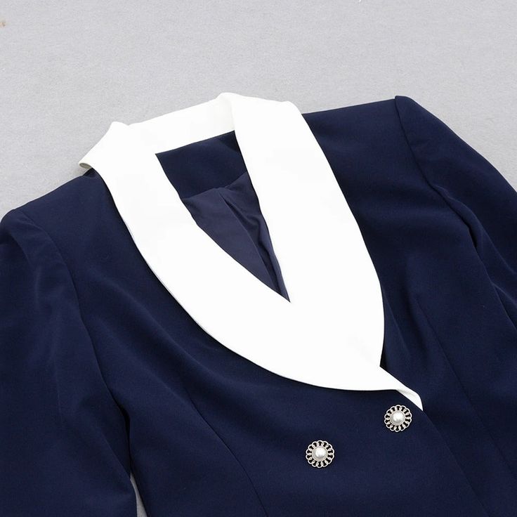 Our Renee Navy Blue Blazer Dress features a fitted double-breasted design style. The blazer dress is embellished with white shawl lapels and pearl buttons. This is a perfect piece for office and work meetings, as well as dressy evening occasions. It's a versatile way to transition from work to play. Whether you're all business or ready to let loose, this blazer dress has you covered. Material: Polyester Care: Dry Clean Elasticity: Non-stretch Elegant Shawl Collar Blazer For Office, Elegant Office Blazer With Shawl Collar, Elegant Single-button V-neck Blazer, Elegant V-neck Single Button Blazer, Elegant Formal Blazer Dress With Single Button, Elegant Single Button Blazer Dress For Office, Elegant Dress With Double-breasted Button And Lapel Collar, Elegant Double-breasted Office Wear Dresses, Elegant Fitted Single Button Blazer Dress