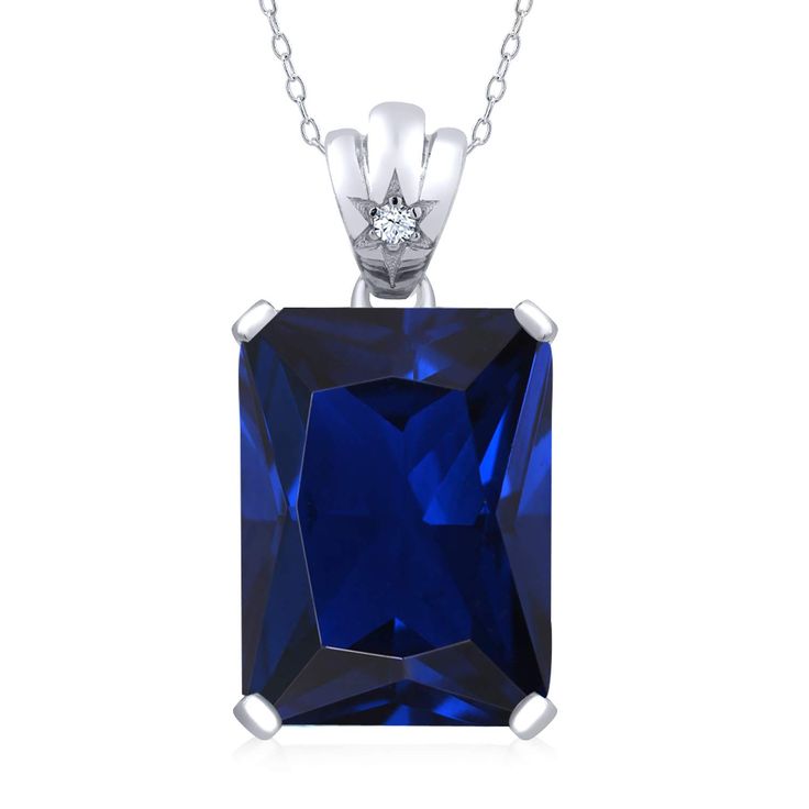 PRICES MAY VARY. Captivating Blue Created Sapphire: This pendant necklace features a stunning 18x13mm emerald-cut blue created sapphire, radiating a mesmerizing deep blue hue that symbolizes wisdom and beauty. It is a true centerpiece that captures attention and creates a lasting impression. Brilliant White Topaz Accents: The blue created sapphire is beautifully complemented by sparkling white topaz accents, adding a touch of elegance and enhancing the overall brilliance of the necklace. Superio Blue Rectangular Lab-created Sapphire Jewelry, Blue Rectangular Necklace For Anniversary, Blue Rectangular Birthstone Necklace, Blue Rectangular Diamond Cut Jewelry, Classic Blue Lab-created Sapphire Necklace, Classic Blue Rectangular Necklace, Ruby Necklace Pendant, Sapphire Necklace Pendants, Topaz Pendant