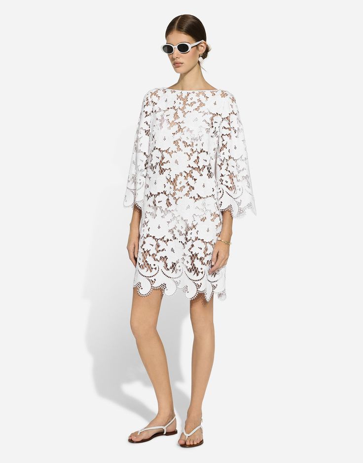 Find DOLCE & GABBANA Floaty Short Cotton Dress With Floral Openwork Embroidery on Editorialist. Floaty short cotton dress with floral openwork embroidery: White Boat neck 3/4 sleeves Unlined Rear zipper and hook-and-eye fastening The piece measures 89.5 cm from the center back on a size IT 40 The model is 175 cm tall and wears a size IT 40 Made in Italy Summer Evening Dress With Cutwork Hem, Spring Lace Dress With Cutwork, Summer Lace Dresses With Intricate Embroidery, White Floral Embroidery Lace Dress For Formal Occasions, Summer Formal Dress With Intricate Embroidery, Formal Summer Dress With Intricate Embroidery, Elegant Spring Dresses With Cutwork, White Lace Dress With Floral Embroidery For Formal Occasions, Formal White Lace Dress With Floral Embroidery