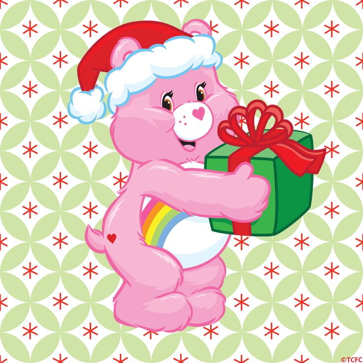 a pink teddy bear holding a green gift box