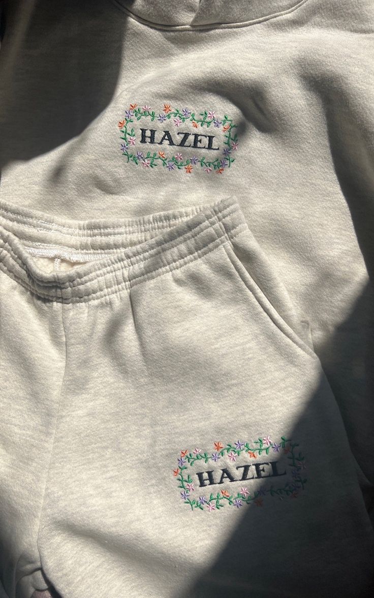 Hazel Exclusive Embroidered Pants OVERSIZED FIT - Comes In Size Small, Medium, and Large Set Sold Separately Any Out Of Stock Items are Due To Restock within 2-3 Weeks, Please Enter Your Email Address to be Notified About Restocks Embroidered Relaxed Fit Pants For Spring, Relaxed Fit Embroidered Pants For Spring, Embroidered Cotton Pants For Loungewear, Oversized Embroidered Tops For Loungewear, Casual Lounge Pants With Floral Embroidery, Spring Embroidered Relaxed Fit Pants, Embroidered Bottoms For Spring Loungewear, Spring Embroidered Bottoms For Loungewear, Cotton Bottoms With Floral Embroidery For Loungewear