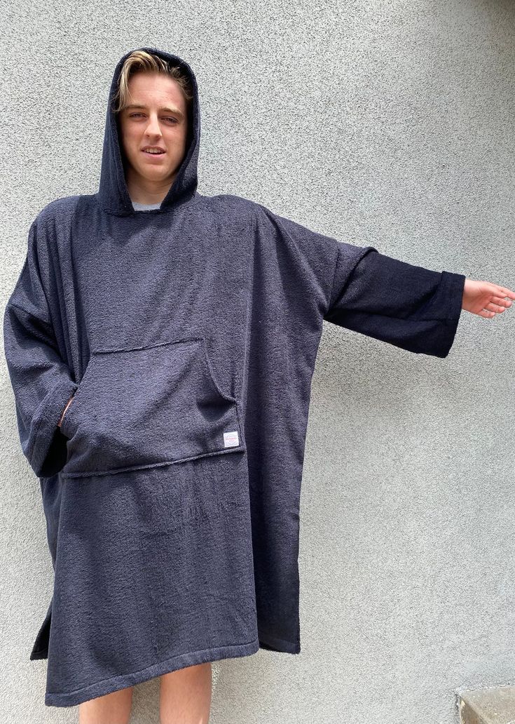 Super soft 100% cotton terry cloth poncho.  Optional Custom logo small on the front chest and large on the back.  Large front pockets and large hood. Long sleeves to keep your arms nice and cozy. Perfect for changing outdoors. Casual Cotton Poncho With Relaxed Fit, Casual Long Sleeve Poncho For Outdoor, Casual Outdoor Poncho, Casual Oversized Poncho With Pockets, Casual Hooded Poncho For Outdoor Activities, Casual Cotton Hooded Poncho, Casual Hooded Poncho With Pockets, Oversized Cotton Poncho For Loungewear, Casual Hooded Cotton Poncho