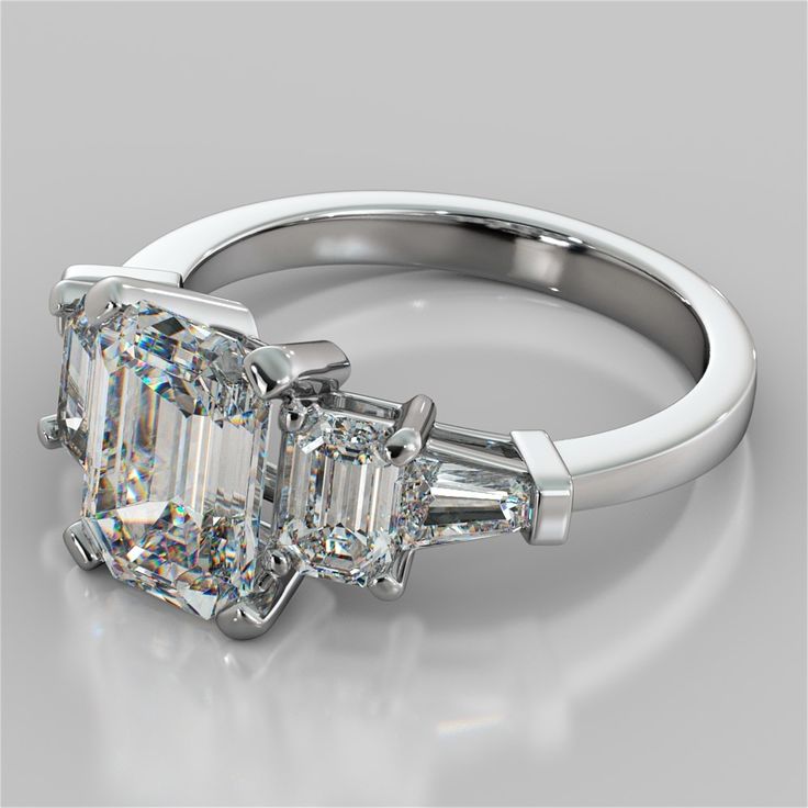 three stone diamond engagement ring with baguetts