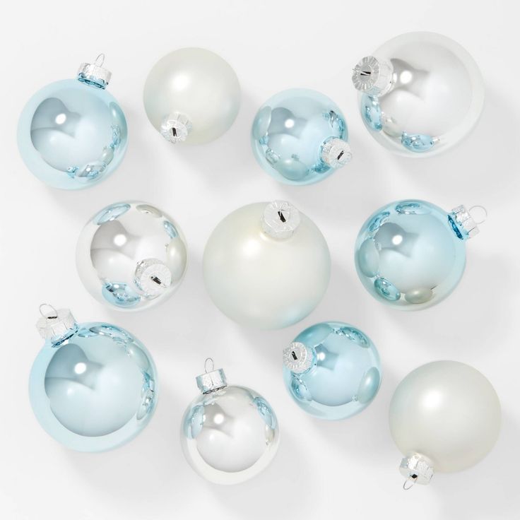 a group of white and blue christmas ornaments