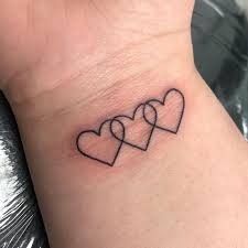 two hearts tattoo on the wrist