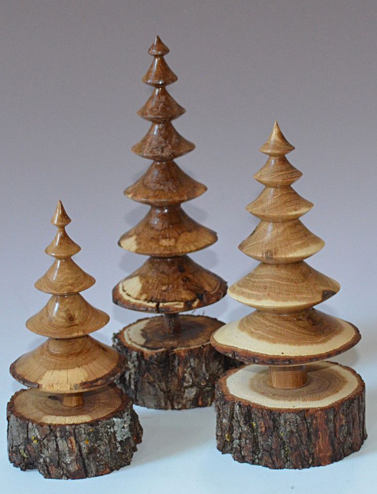 three wooden christmas trees sitting on top of each other