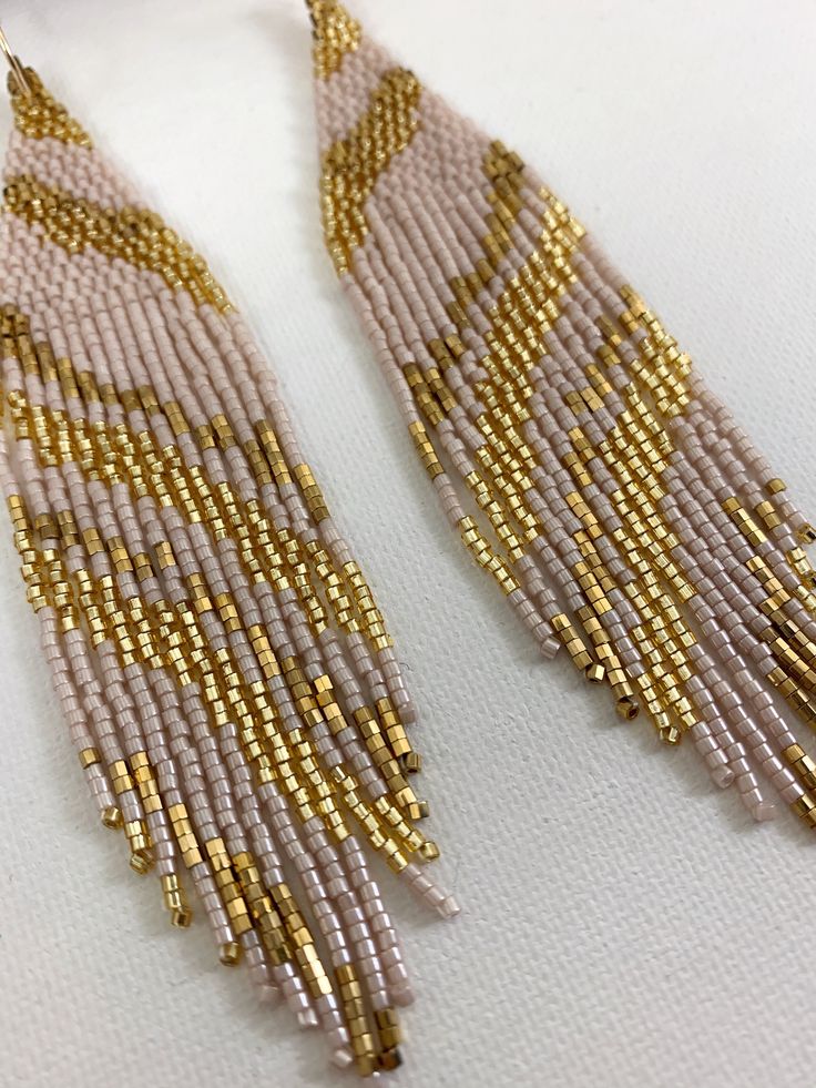 "Blush and gold boho seed bead earrings, beaded earrings, bridal earrings, Boho wedding jewelry Length 5\" including ear wire Width 1\" Made with best quality Japanese seed beads, and 24k gold dipped seed beads Lightweight and unique extravagant style - designed and made by Luba Ro Colors used - 24k gold, shimmering gold and blush Select closure earwires leverbacks clip-ons for non pierced ears" Boho Wedding Jewelry, Blue Beaded Earrings, Earrings Beaded, Blush And Gold, Gold Dipped, Seed Bead Earrings, Earrings Boho, Bead Earrings, Ear Wire