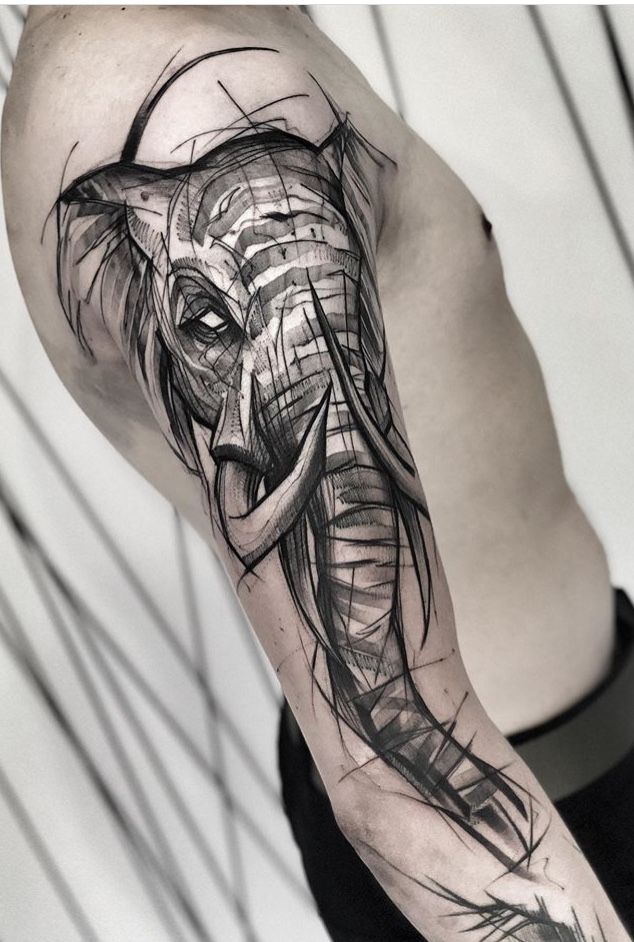 an elephant tattoo on the right arm and shoulder, with lines coming out of it