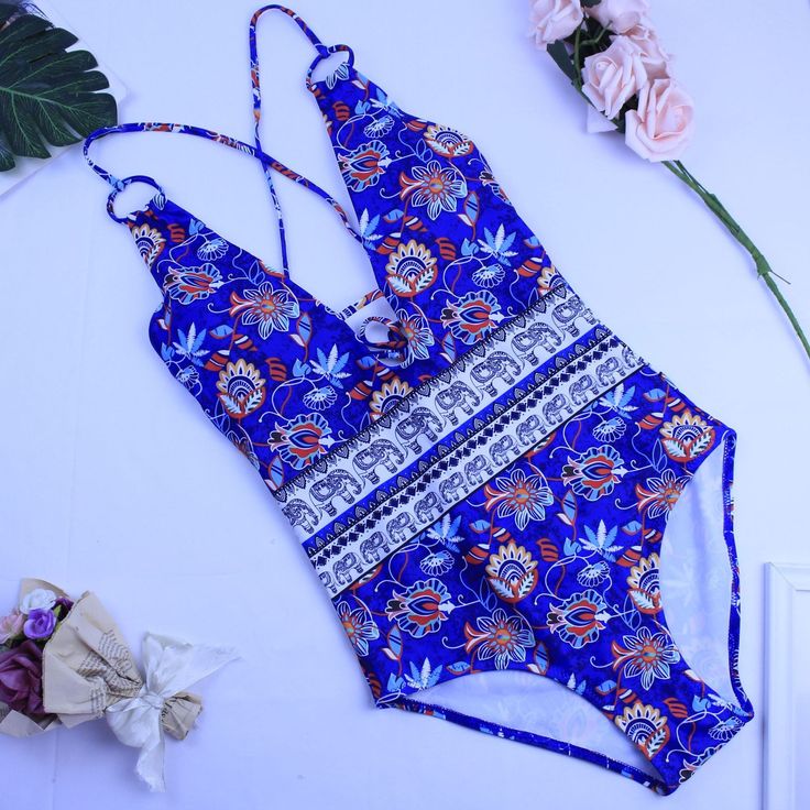 Straw hats and sandy knees are just right in the Coastal One Piece Swimsuit. Bohemian style mixed floral print swimwear offers the perfect amount of coverage. Swim or lounge because you can enjoy it in and out of the water. Congratulations, you are one of the first to try our new swim collection! Details: Bohemian style Coastal One Piece Swimsuit Bust is padded and wire free This style runs small, we recommend sizing up one full size from your typical size Let us know how we did so we can contin Summer Tropical Print Swimwear, Beachy Printed Swimwear For Summer, Beachy Printed Summer Swimwear, Printed Swimwear For Summer Beach Party, Printed Swimwear For Vacation Pool Use, Summer Printed Swimwear For Poolside, Printed Swimwear For Beach Vacation, Tropical Print Swimwear For Summer Beach, Printed Summer Beach Swimwear