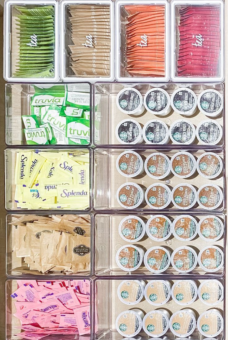 an organized drawer filled with lots of crafting supplies and thread spools in plastic containers